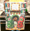 Home sweet home tea towel with cozy fireplace scene.